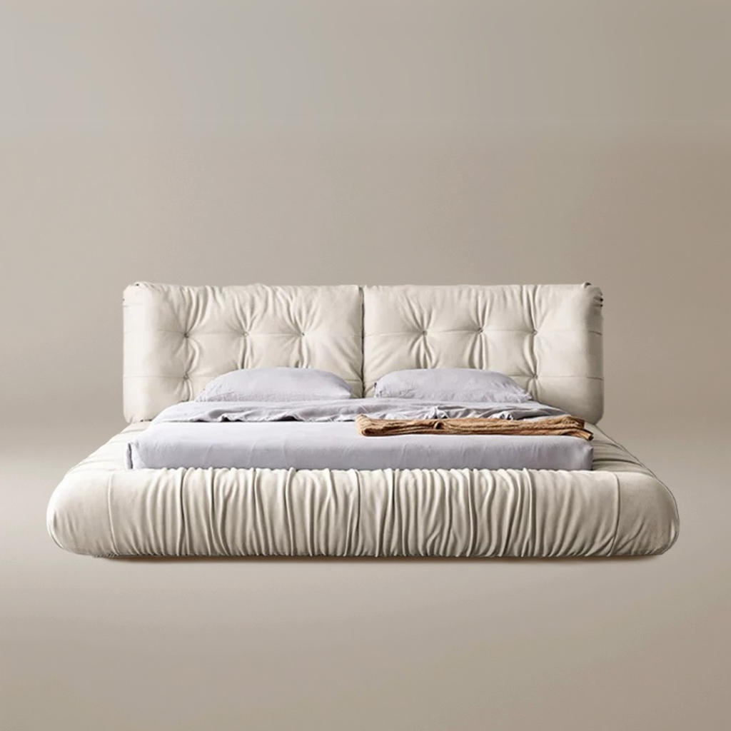 A luxurious beige upholstered Italian-style Cloud Bed with a high headboard and plush cushioning, resembling the softness of clouds.