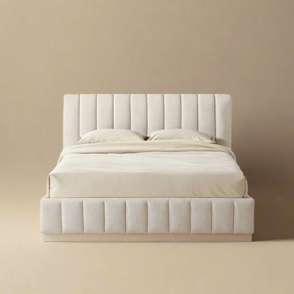 Front view of the Alora Ashwood bed featuring a vertical channel tufted headboard and matching footboard with a light wood plinth base.
