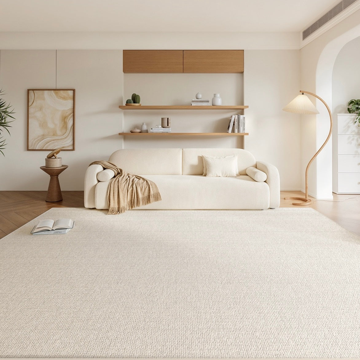 Amara Rug in a soft cream tone styled in a modern living room with a beige sofa, wood accents, and neutral decor