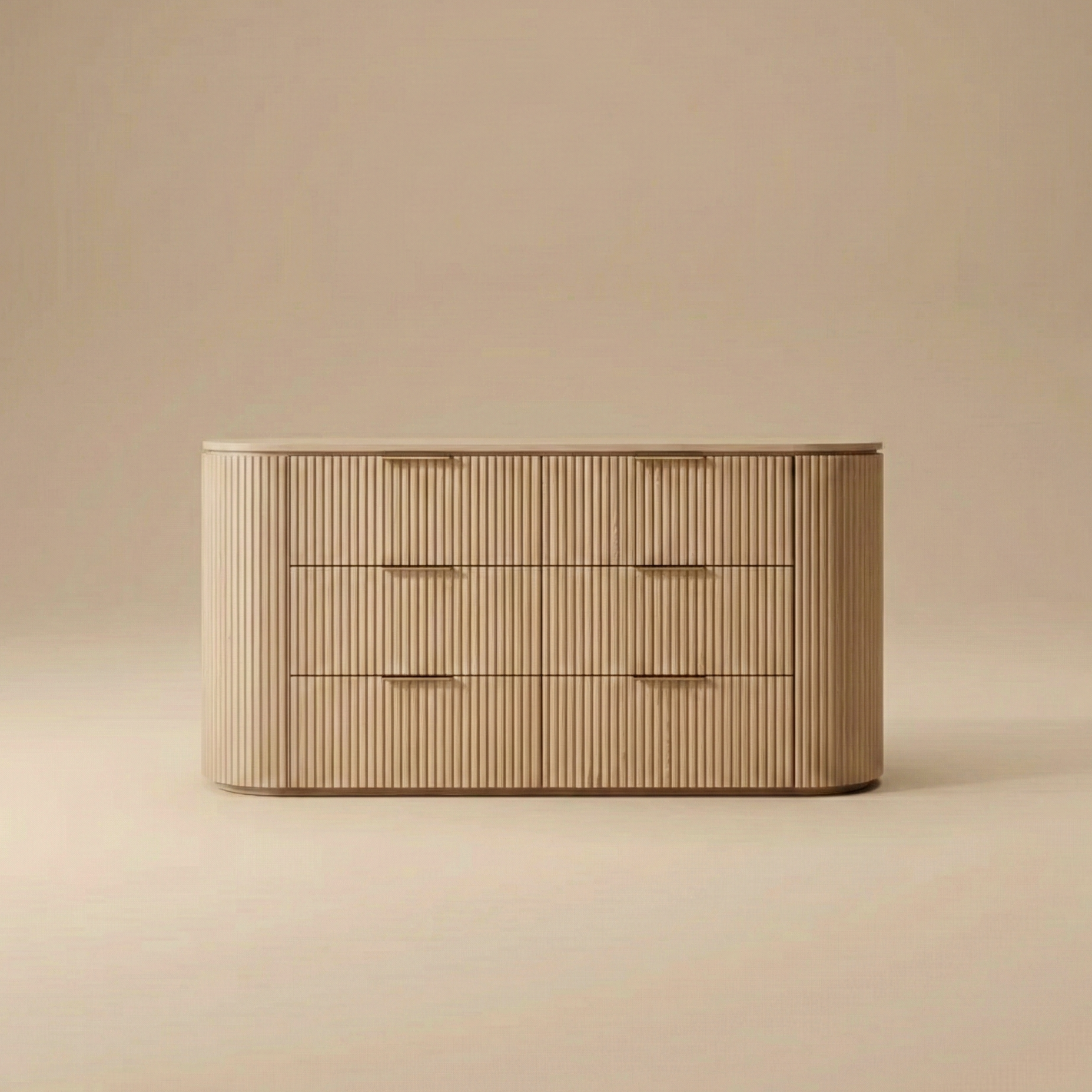 Arden oak dresser featuring a curved silhouette with vertical fluted wood texture and six spacious drawers with brass finger pulls.