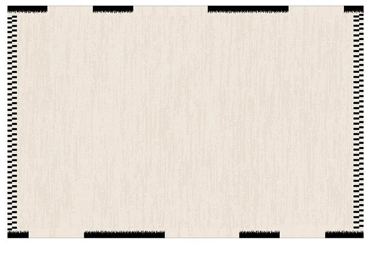 Atelier Border Area Rug with cream center and bold black patterned edges