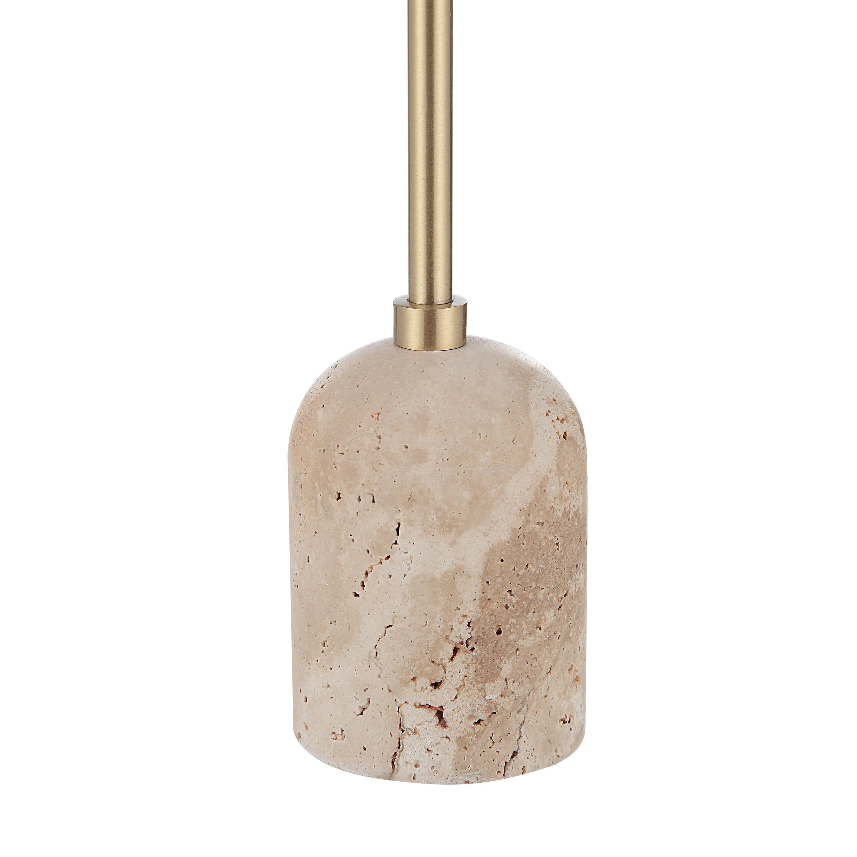 Close-up of Aurelia Candle Holder showing travertine stone base and brass stem connection detail