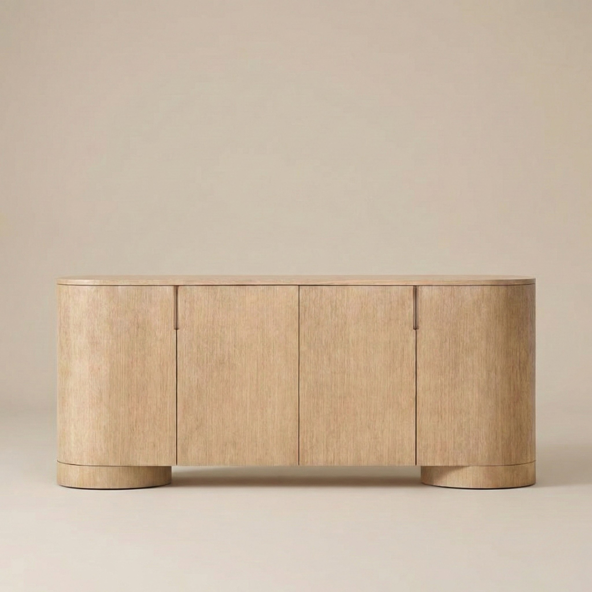 Front view of the Aurelian light oak sideboard showing the seamless four-door design and natural wood texture.