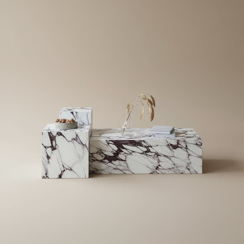 Bulgari Charm Coffee Table in white marble with dark veining styled in a beige studio