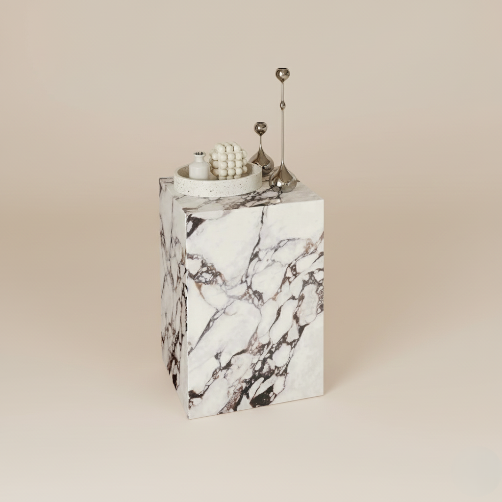 Bulgari Charm Tall Side Table with sculptural pedestal form and elegant veining, styled with decorative objects in studio setting