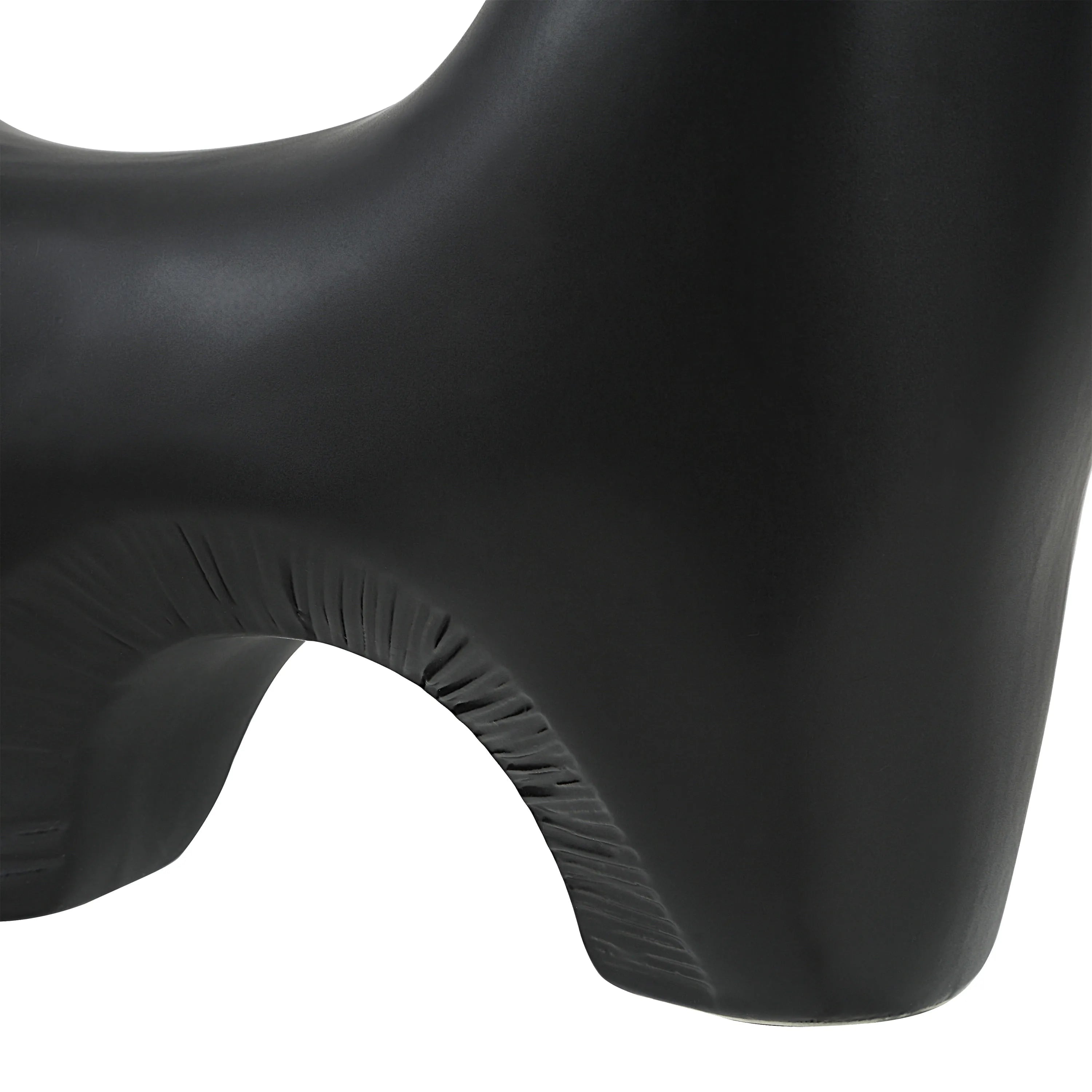Close-up of Caldera Vase in matte black showing detailed arch texture and smooth sculptural curve