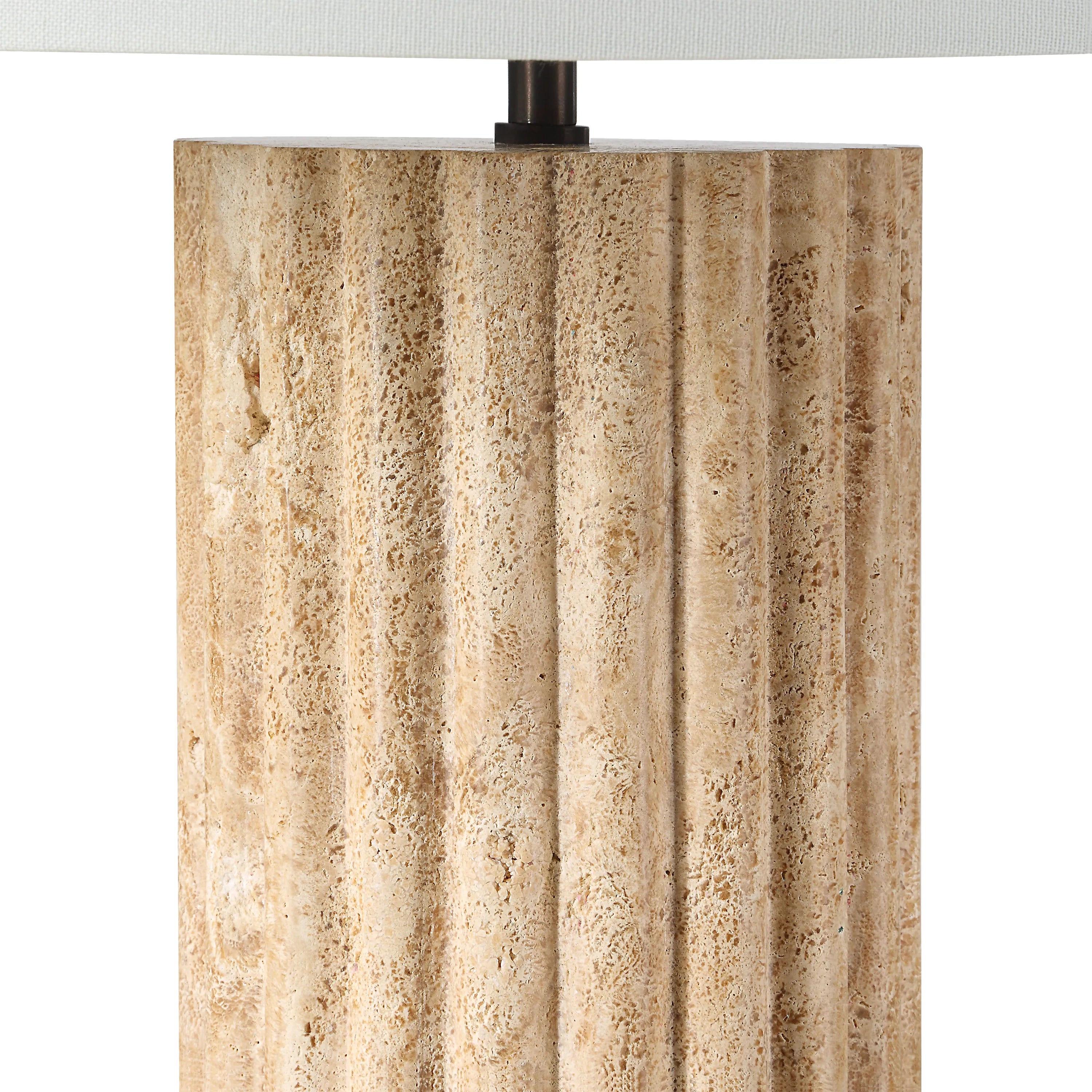 Close-up of Callisto Travertine Table Lamp showing natural fluted stone texture and warm beige surface details
