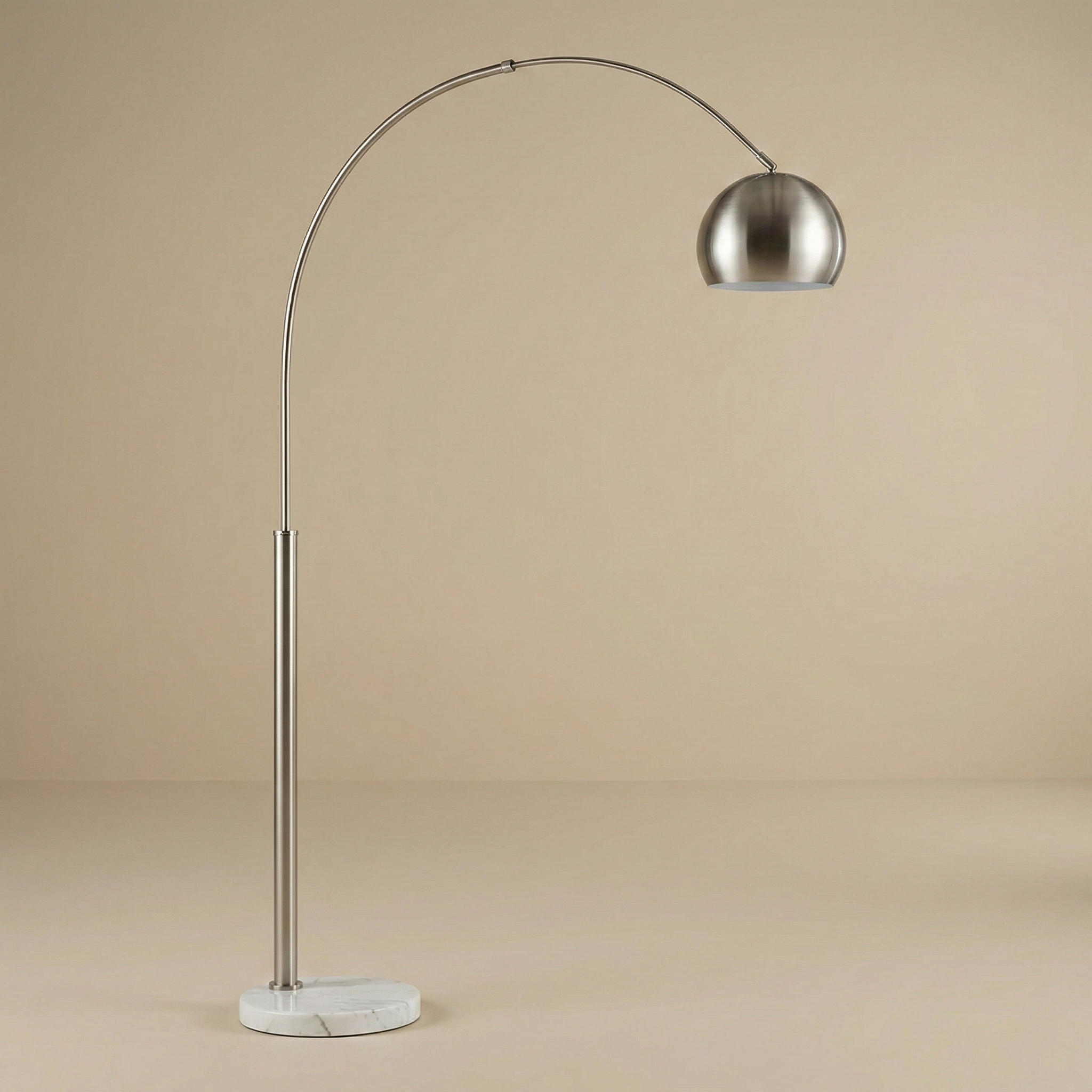 Front view of the Cassia silver arc lamp showing the adjustable dome shade and sturdy round marble base.