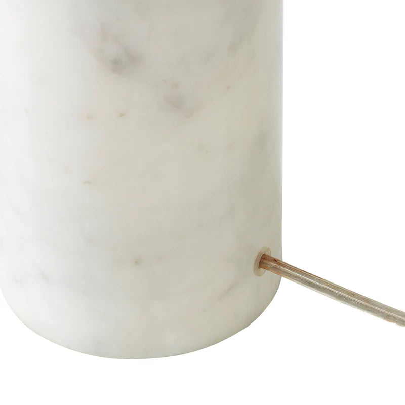 Detail view showing the clear cord exit on the back of the Celine lamp's marble base, maintaining a clean minimalist aesthetic.