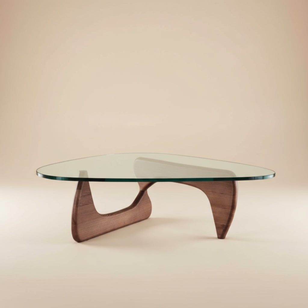 Contour Glass Coffee Table featuring sculptural wooden base and curved glass top in a neutral studio setting