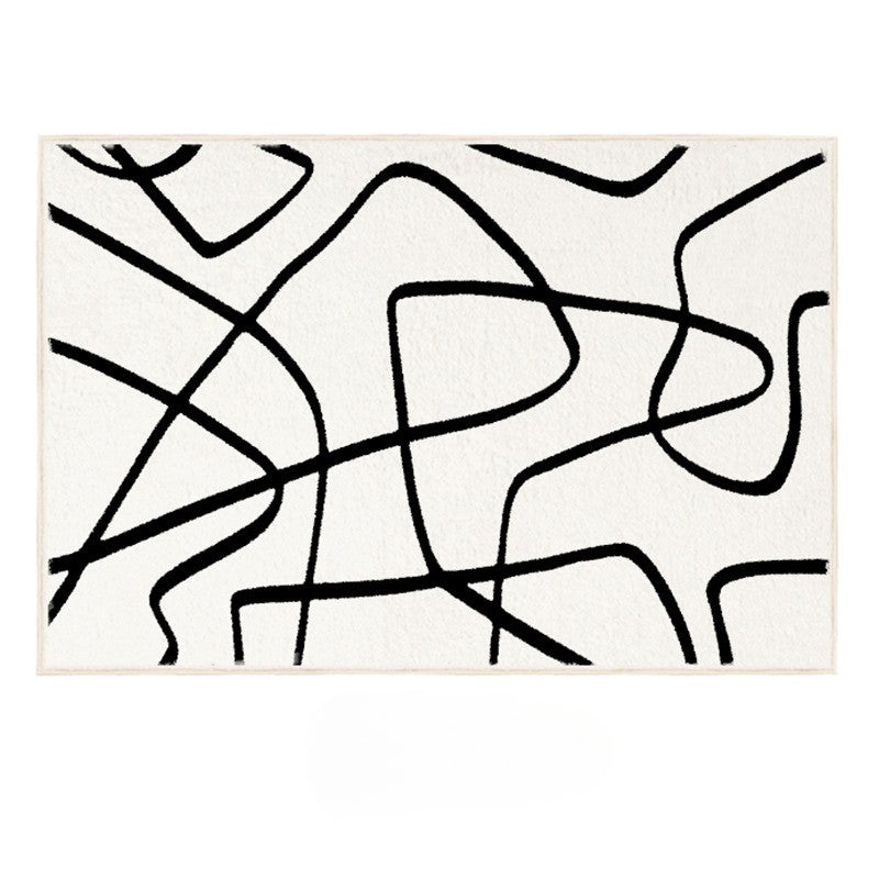 Eclipse Black and White Abstract Rug featuring bold black line patterns on an ivory background