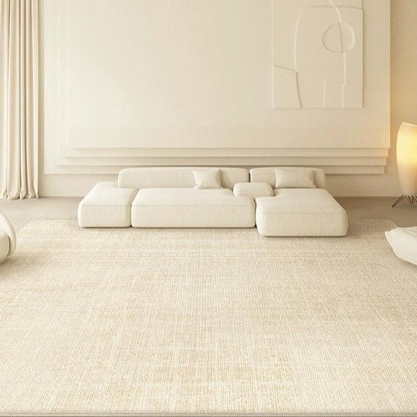 Elise Rug styled in a minimalist beige living room with low modular sofas and soft neutral decor