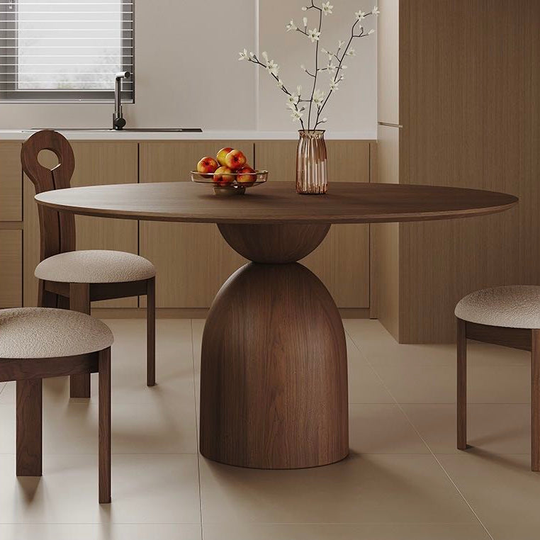 Evelyn walnut round dining table with sculptural pedestal base in modern kitchen