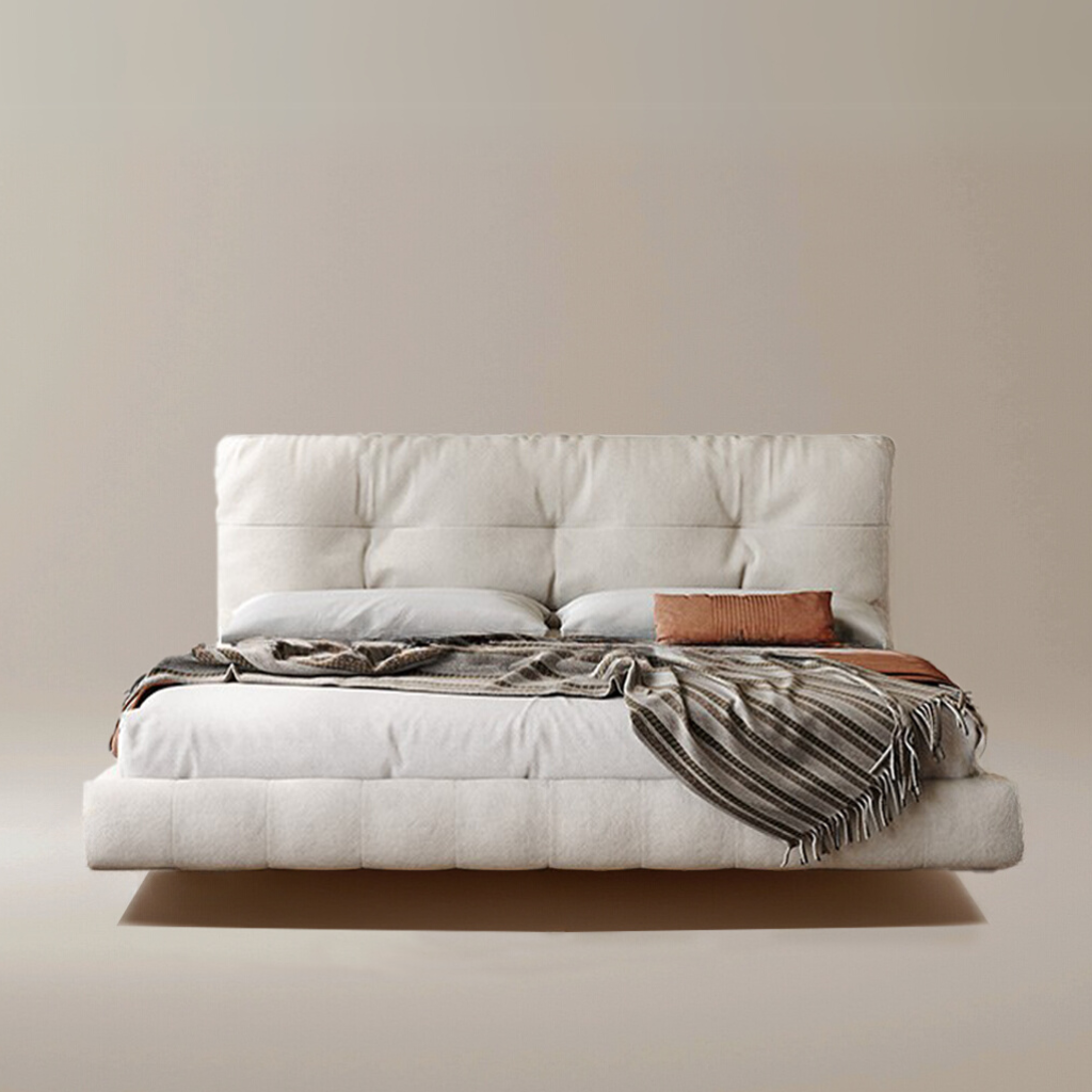 Floating Platform Bed Frame in beige fabric with tufted headboard and layered bedding on neutral studio background