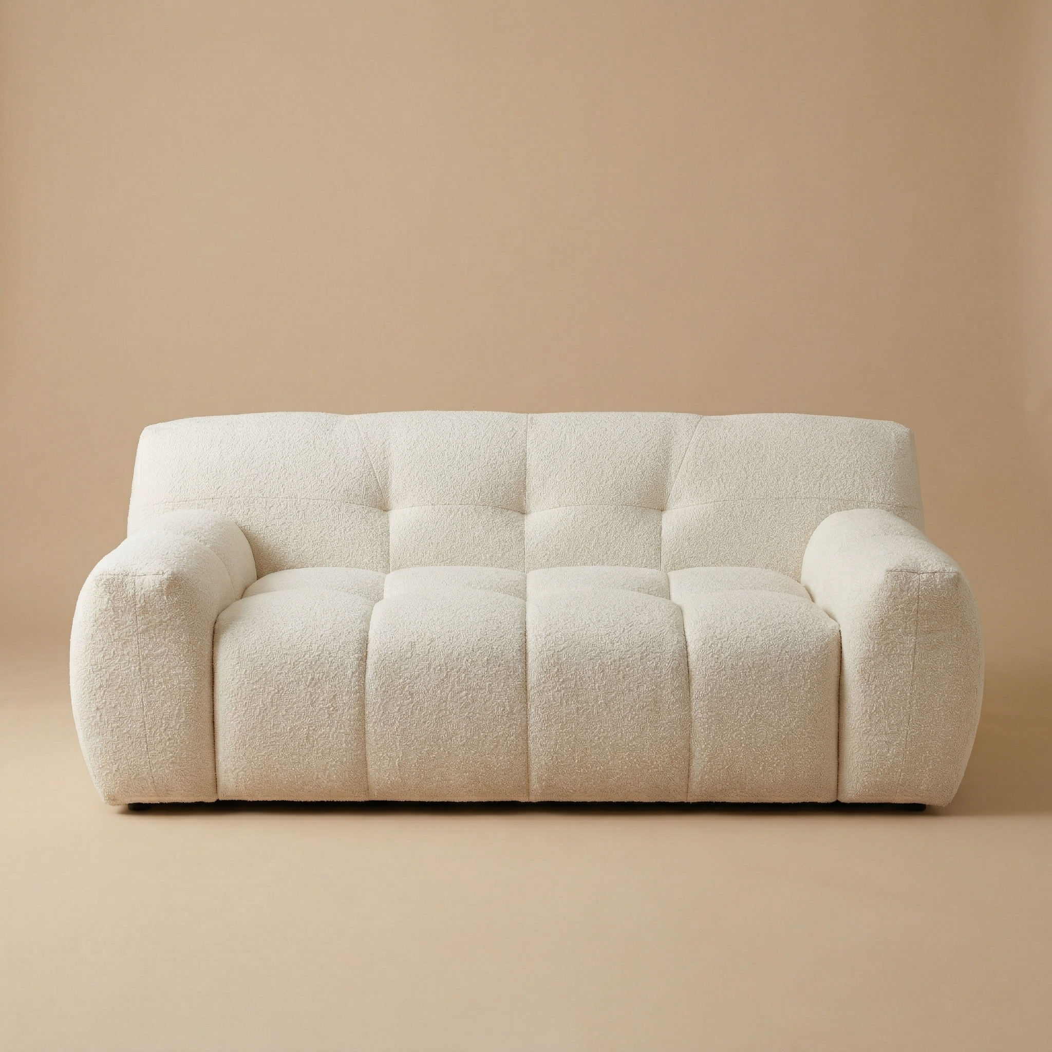 Front view of the Gummy loveseat variant, highlighting the plush vertical segments and low-profile silhouette.