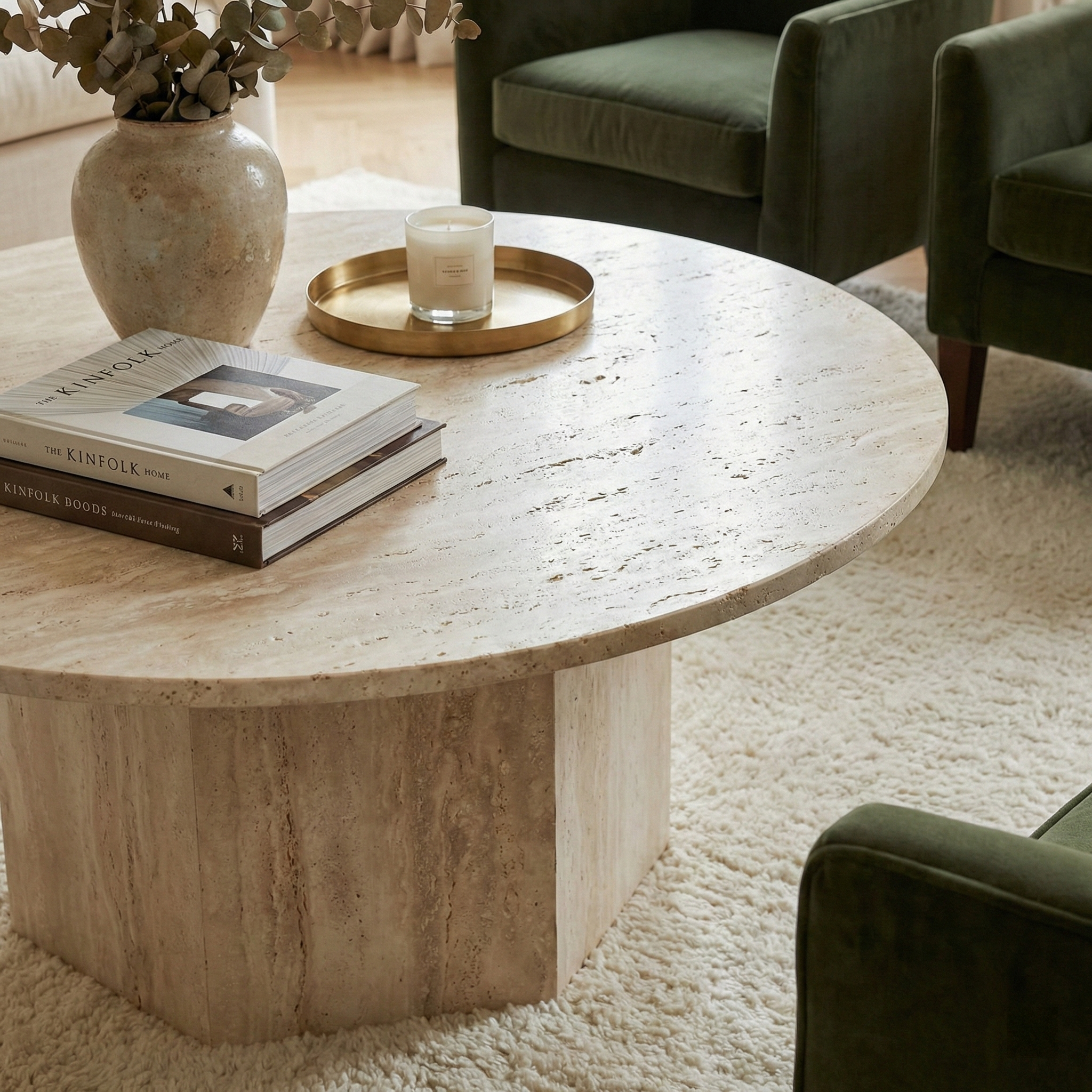 Close up detail of the Harmony coffee table showing the natural beige travertine stone texture and porous surface character.