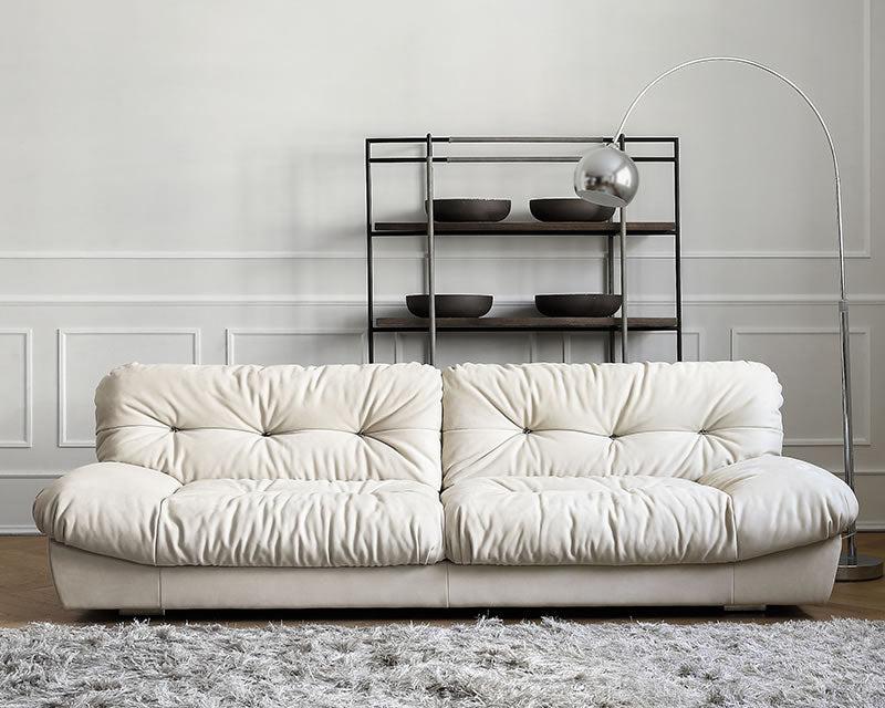 Italian-style Cloud Sofa in cream ultra suede upholstery with tufted cushions, displayed in a bright modern living room
