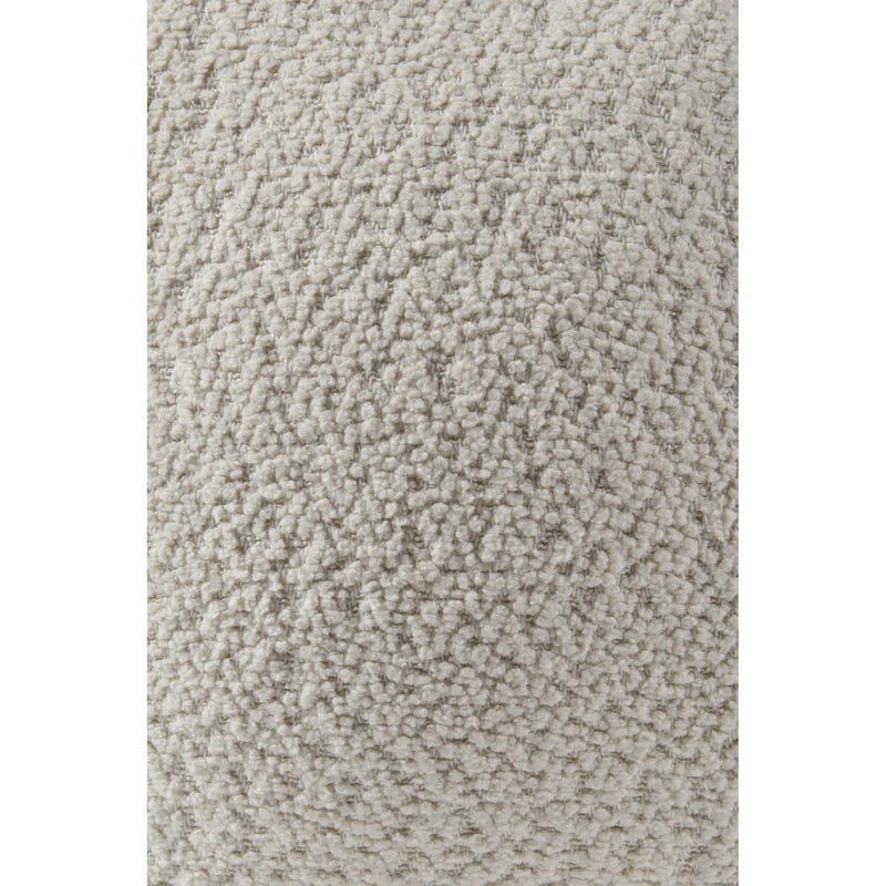 Close up detail of the ivory bouclé fabric showing the nubby, textured sherpa-style surface of the sphere pillow.