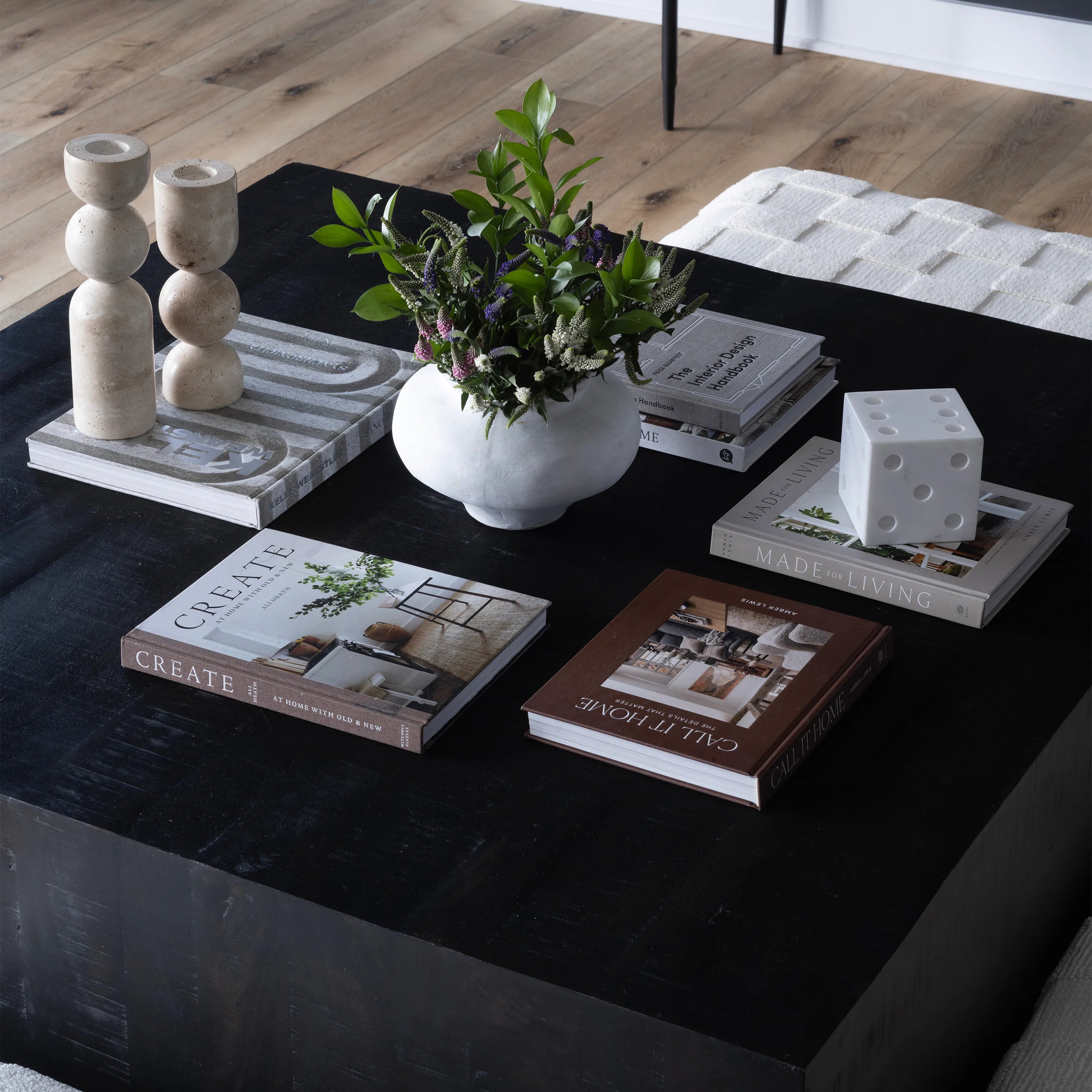 Leros Vase styled on black coffee table with greenery arrangement and stacked decor books