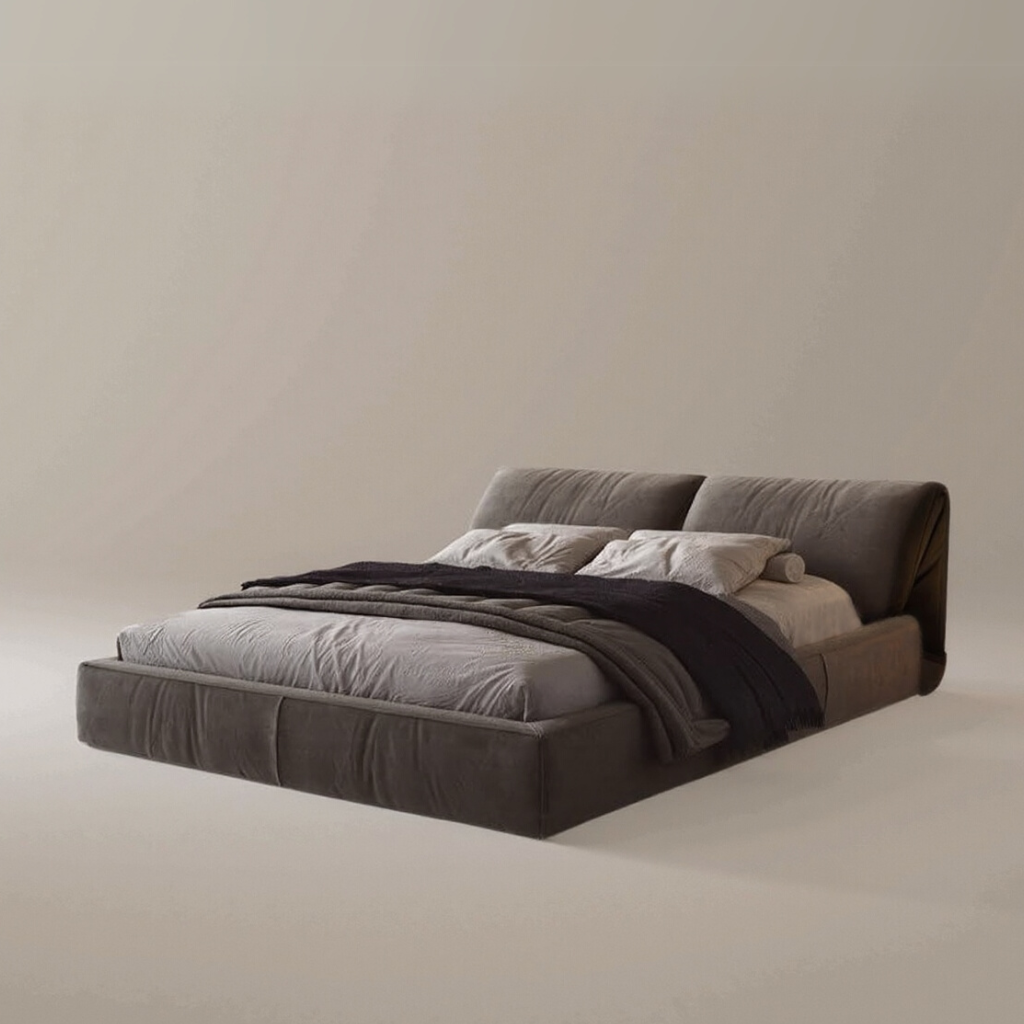 Luxury Elephant Ear Bed Frame in dark grey fabric with plush headboard and layered bedding on beige studio background