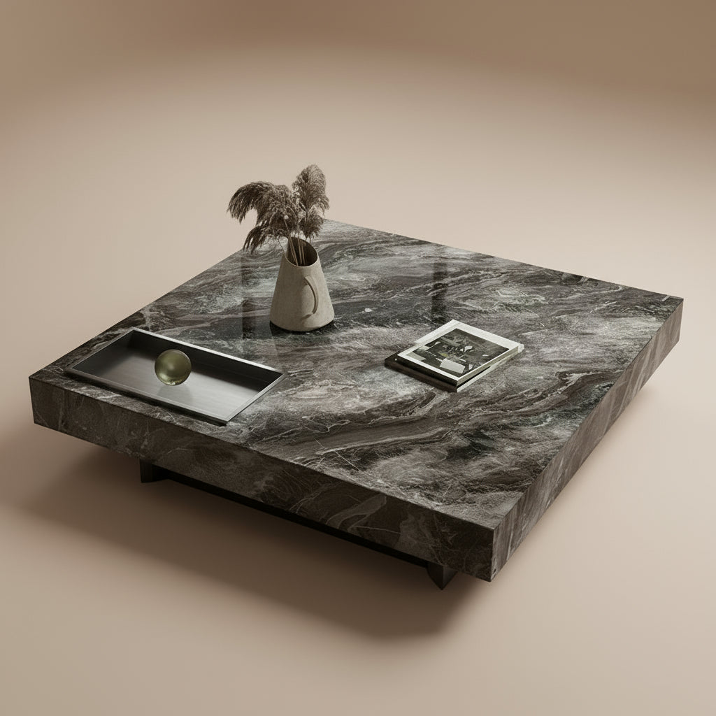 Marble Essence Coffee Table in dark grey stone finish styled with a vase and book in a beige studio
