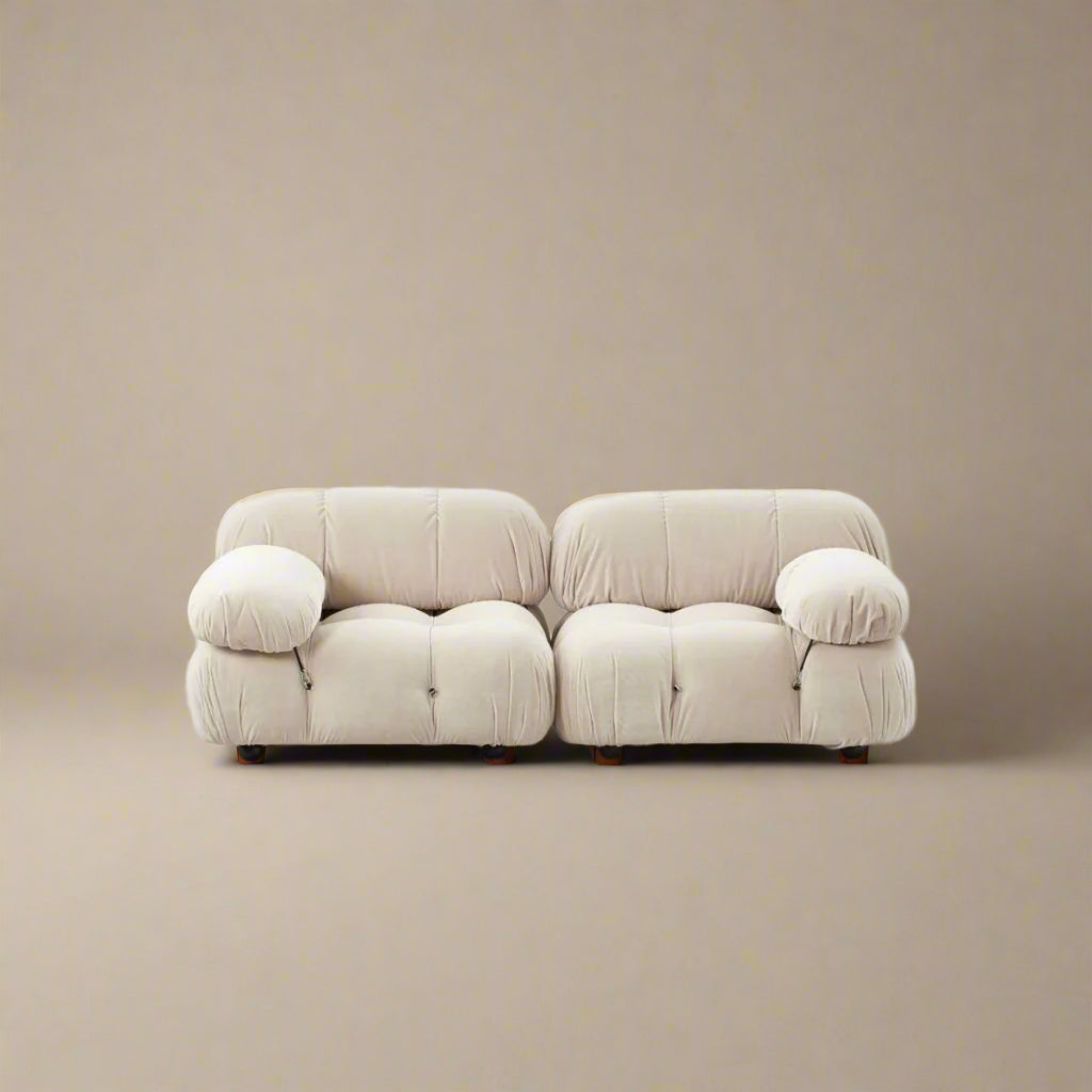 Mario Bellini Sofa in white bouclé fabric two-seater configuration with plush tufted design on beige studio background