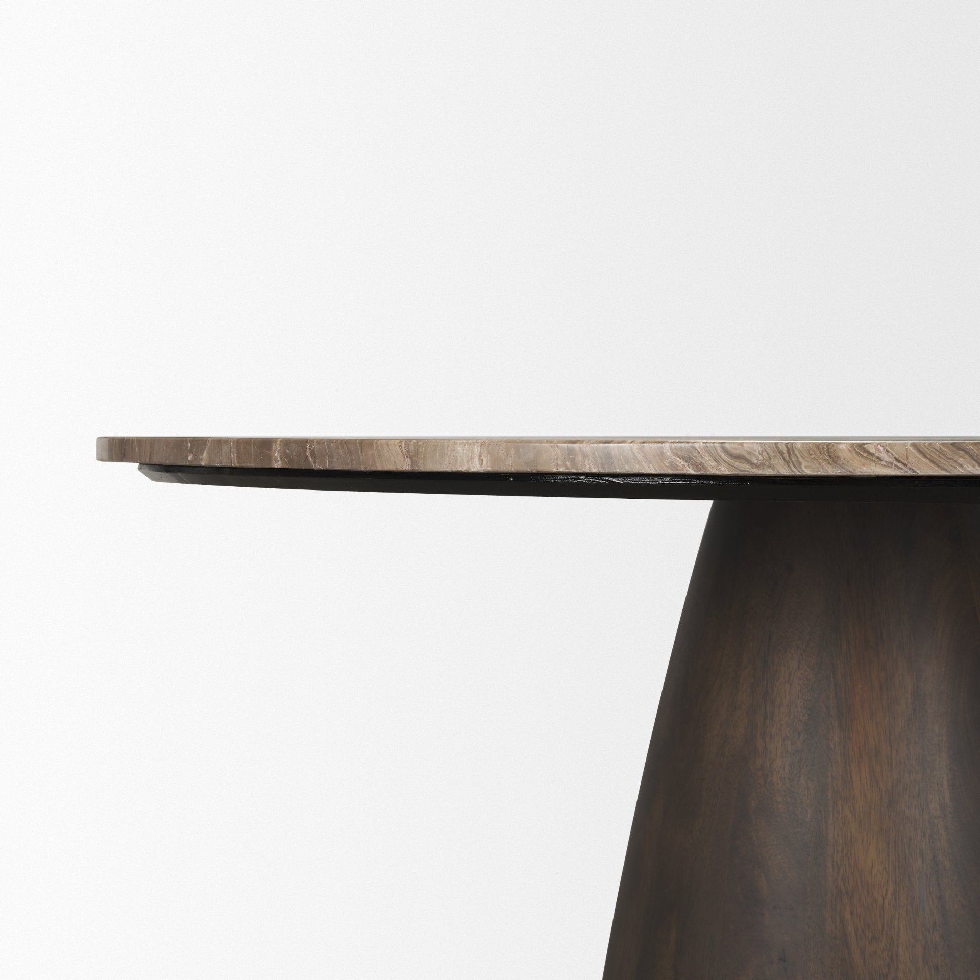 Profile view of the Mateo table highlighting the sleek connection between the thin marble top and the substantial dark wood conical base.