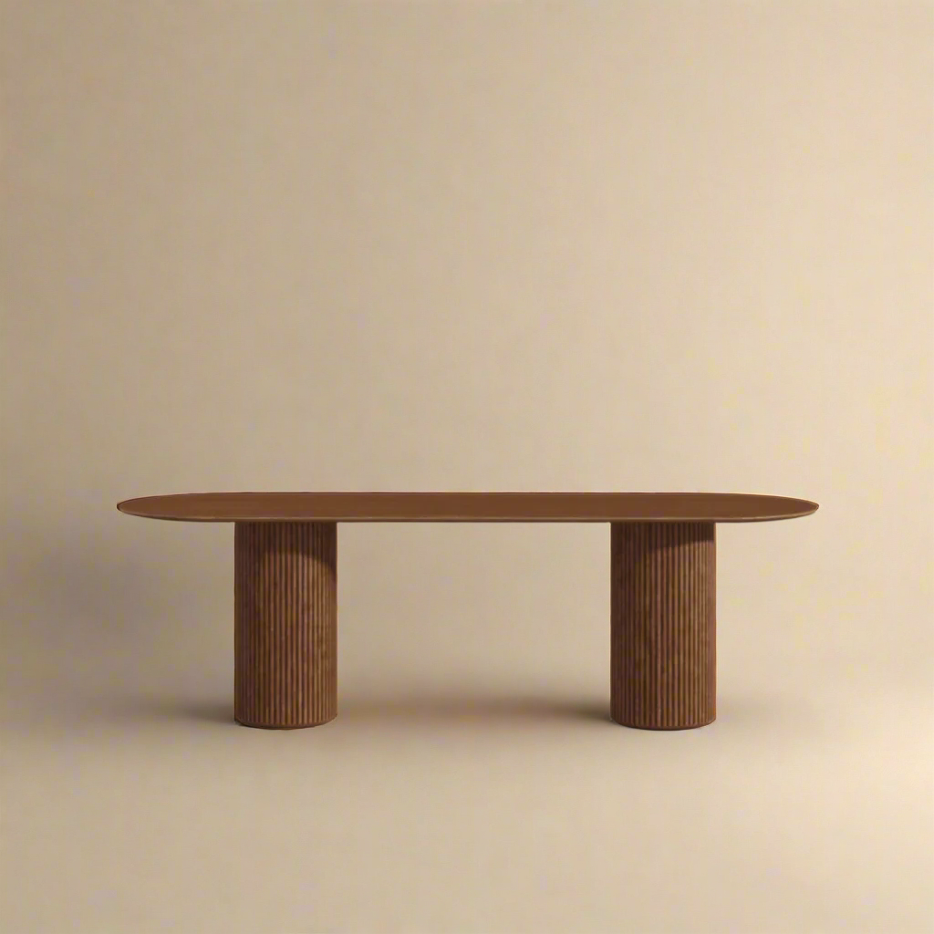Modern Zen solid wood dining table with twin fluted cylindrical bases and smooth oval top in a warm beige studio setting