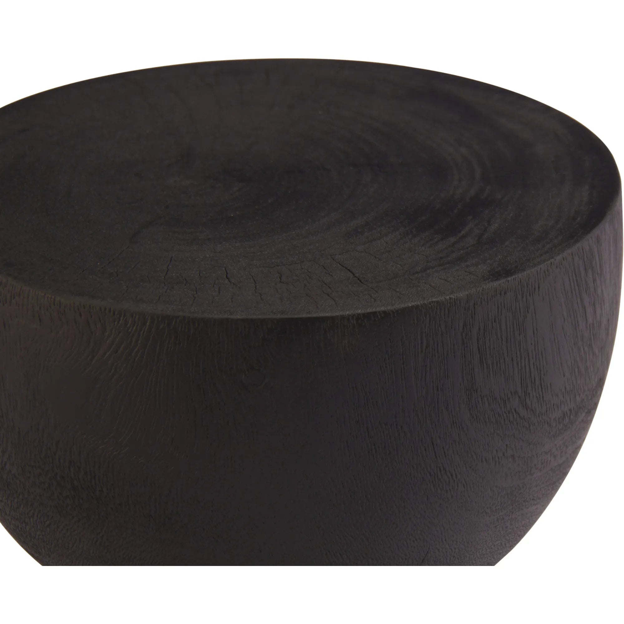 Close up of the Onda table showing the rich black wood grain texture and smooth rounded top surface.