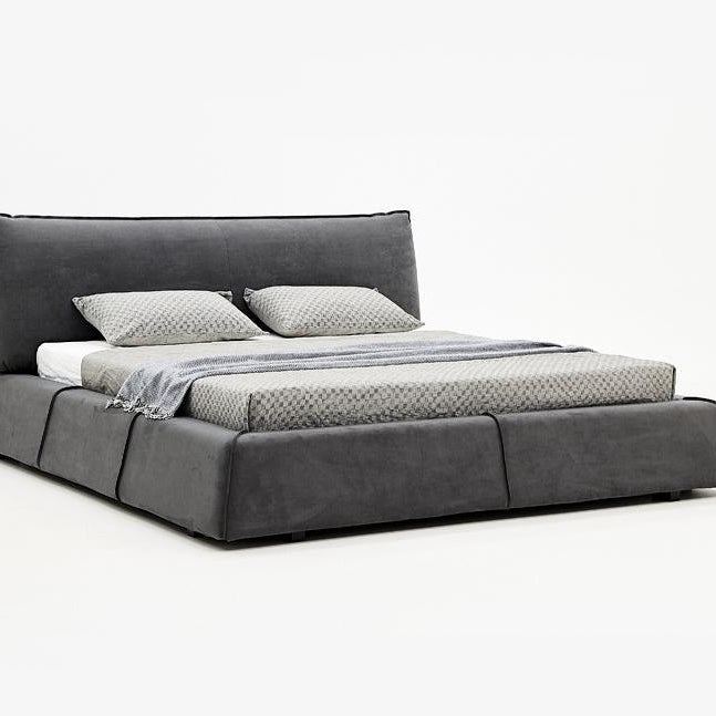 Paris Elegance Grey Platform Bed with low modern frame and soft cushioned headboard on white studio background