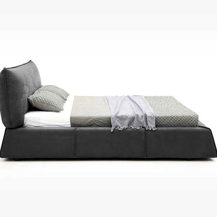 Paris Elegance Grey Platform Bed side profile showcasing low modern frame and plush angled headboard in studio setting