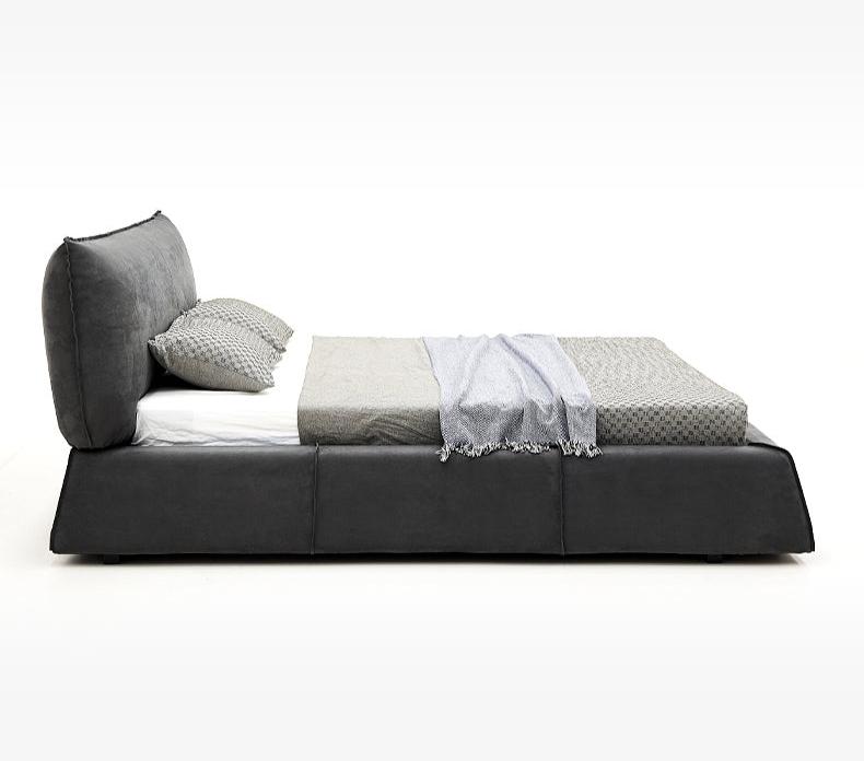 Paris Elegance Grey Platform Bed side profile showcasing low modern frame and plush angled headboard in studio setting