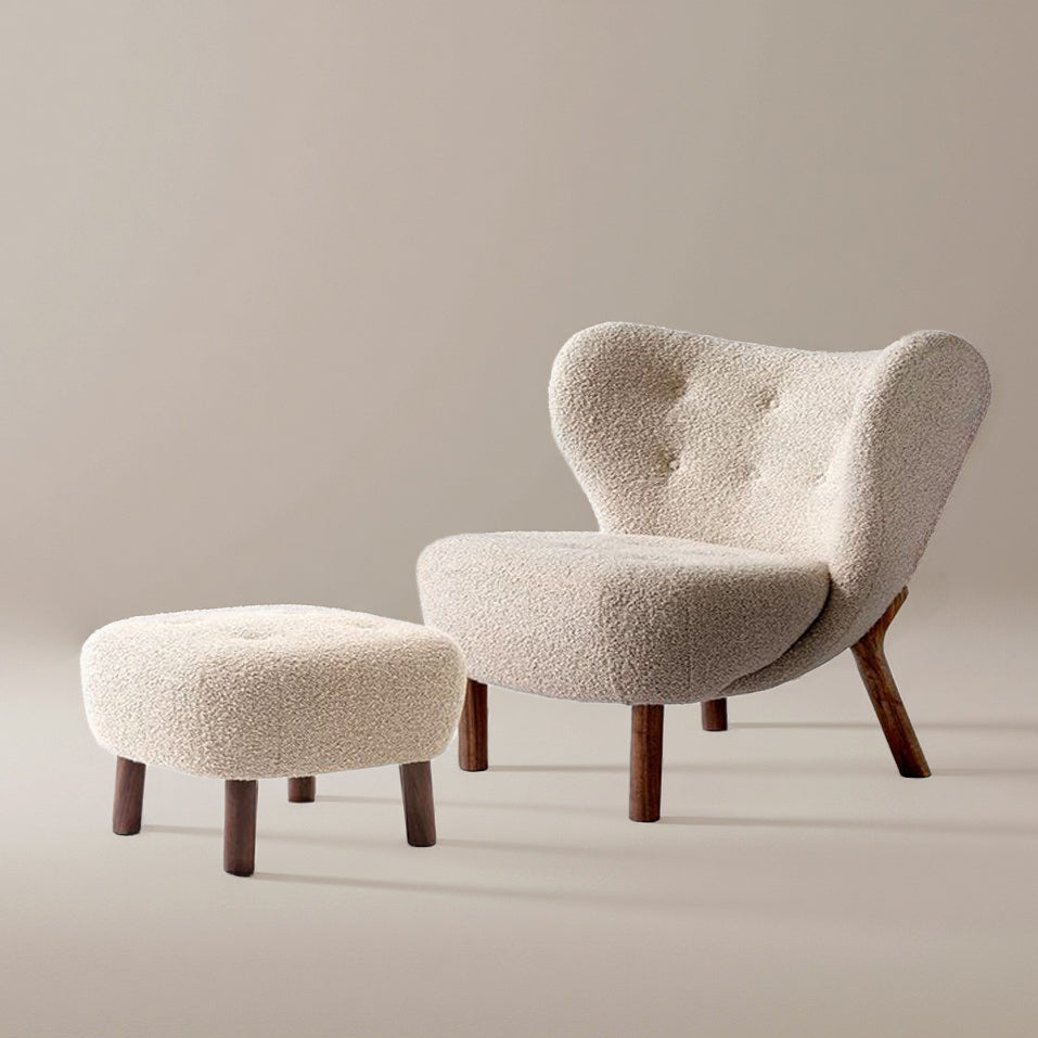 Petra Accent Chair with matching ottoman in cream boucle fabric and wooden legs on beige studio background