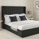 Plush Velvet Storage Bed in black velvet with vertical panel headboard, styled with white bedding and black accent pillows