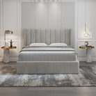 Plush Velvet Storage Bed in soft grey velvet with vertical panel headboard and modern marble side tables in an elegant bedroom