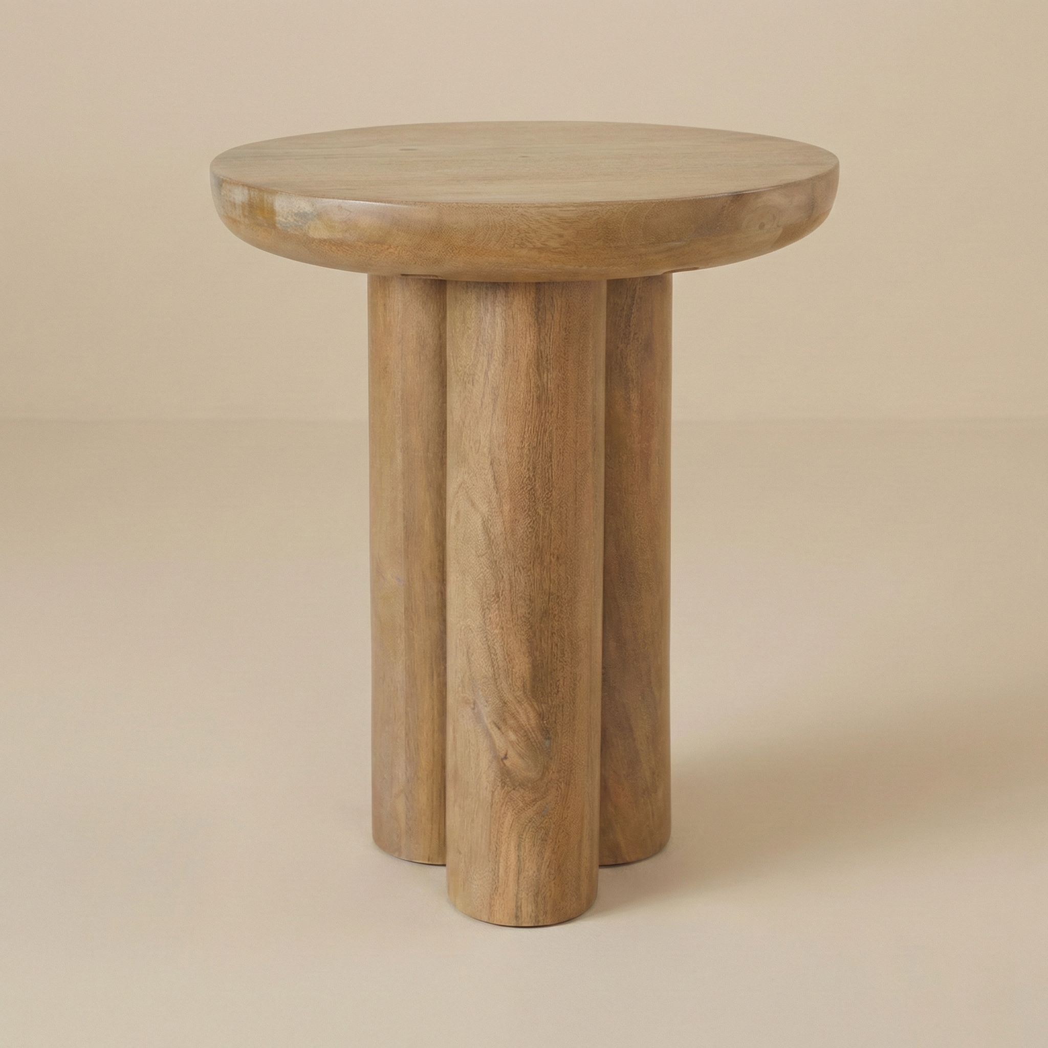 Ryn round side table in natural wood featuring three chunky cylindrical legs and a thick solid wood top.