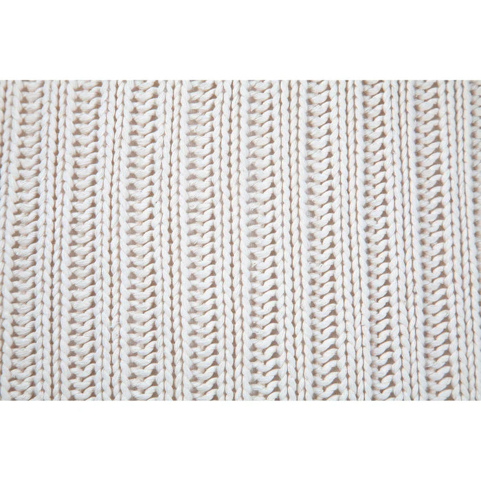 Macro close-up of the vertical chunky knit ribbed fabric texture on the cream Sadie throw pillow.