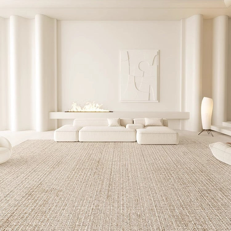 Sandy Oasis Rug styled in a minimal beige living room with low modular sofa and soft ambient lighting