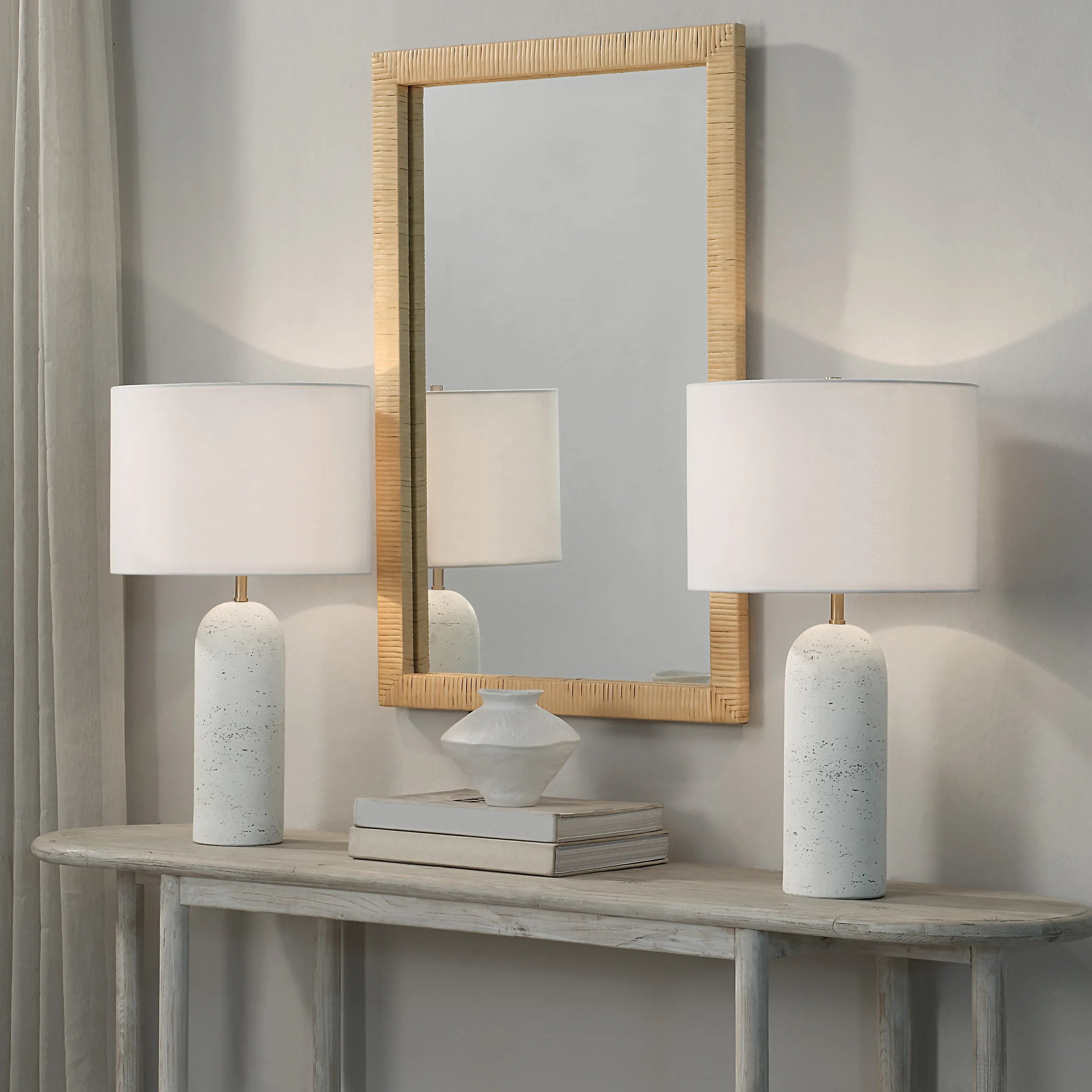 Sienna Sculpted Table Lamps styled on console table with mirror and ceramic decor in soft neutral entryway
