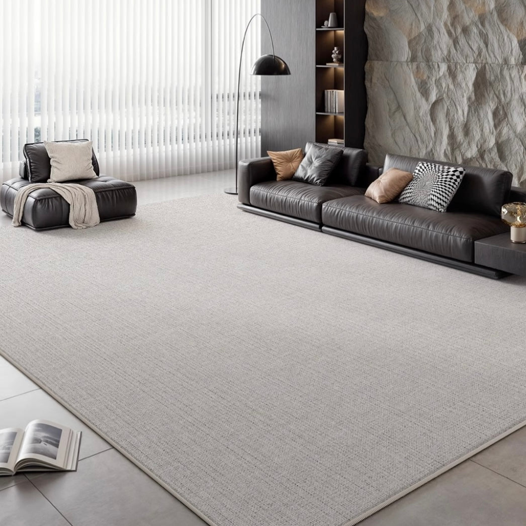 Slate Gray Area Rug styled in a modern living room with leather seating and stone accent wall