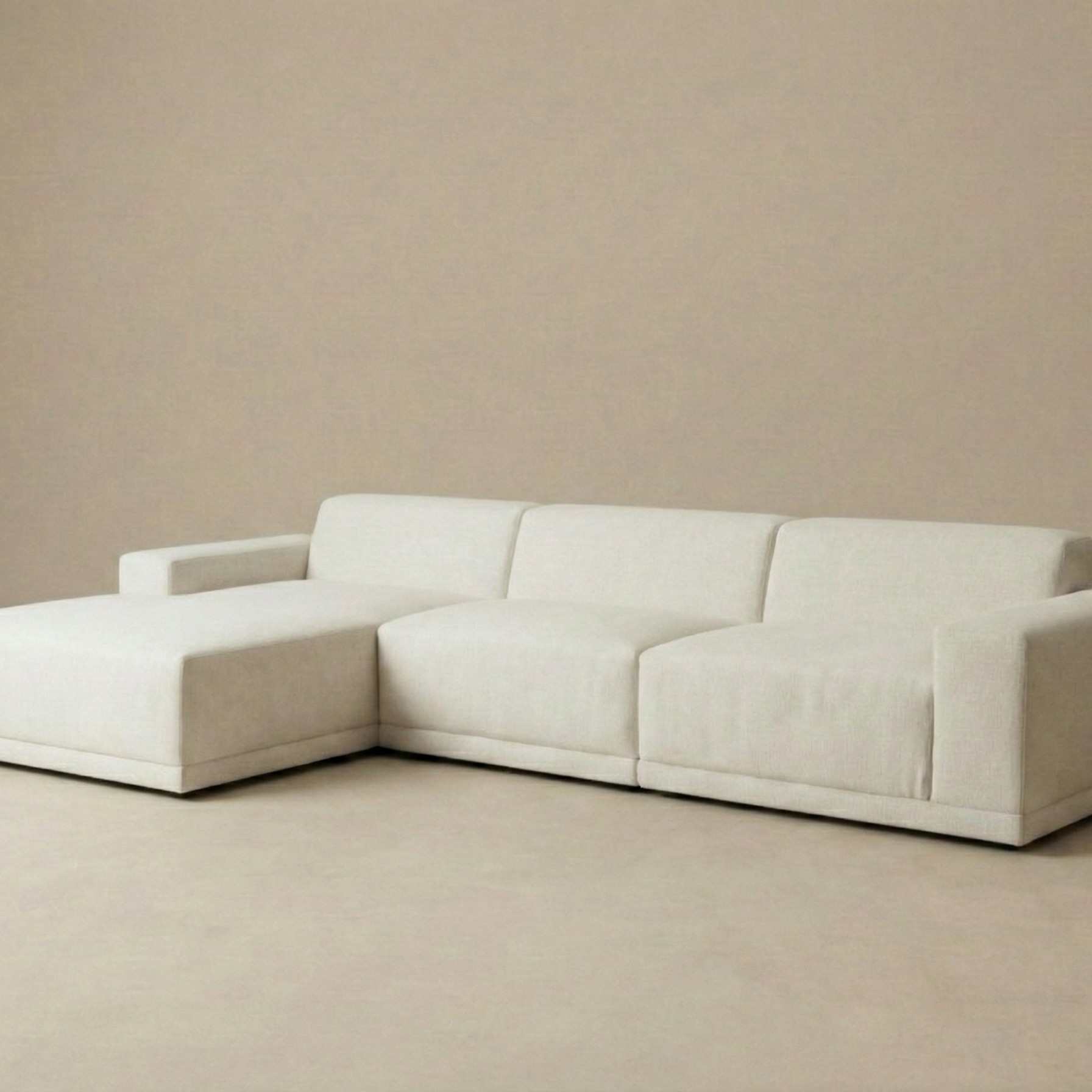Angled view of the Solis modular sectional sofa showing the deep seating and textured beige linen fabric.