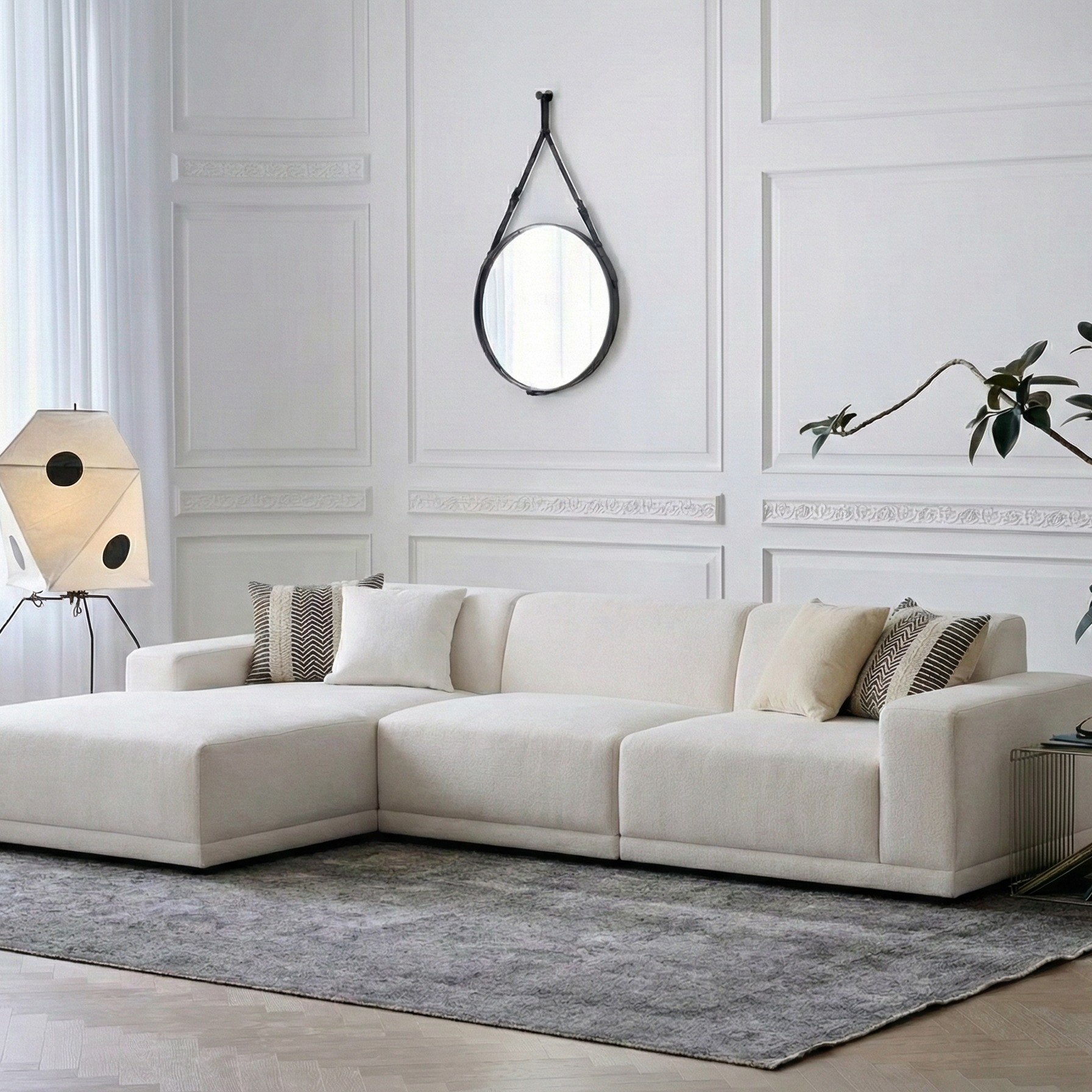 Solis modular sofa with left chaise shown in a bright living room setting from a wide front angle