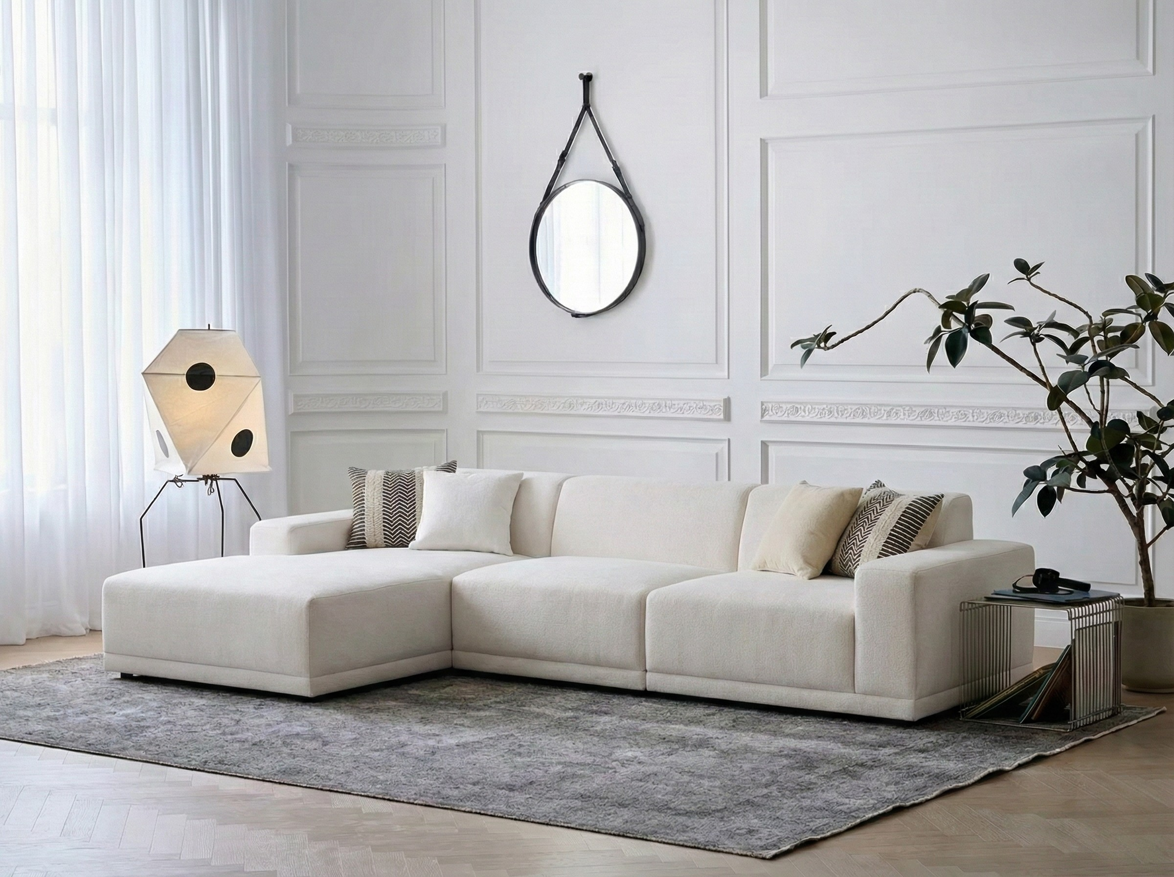 Solis modular sofa with left chaise shown in a bright living room setting from a wide front angle