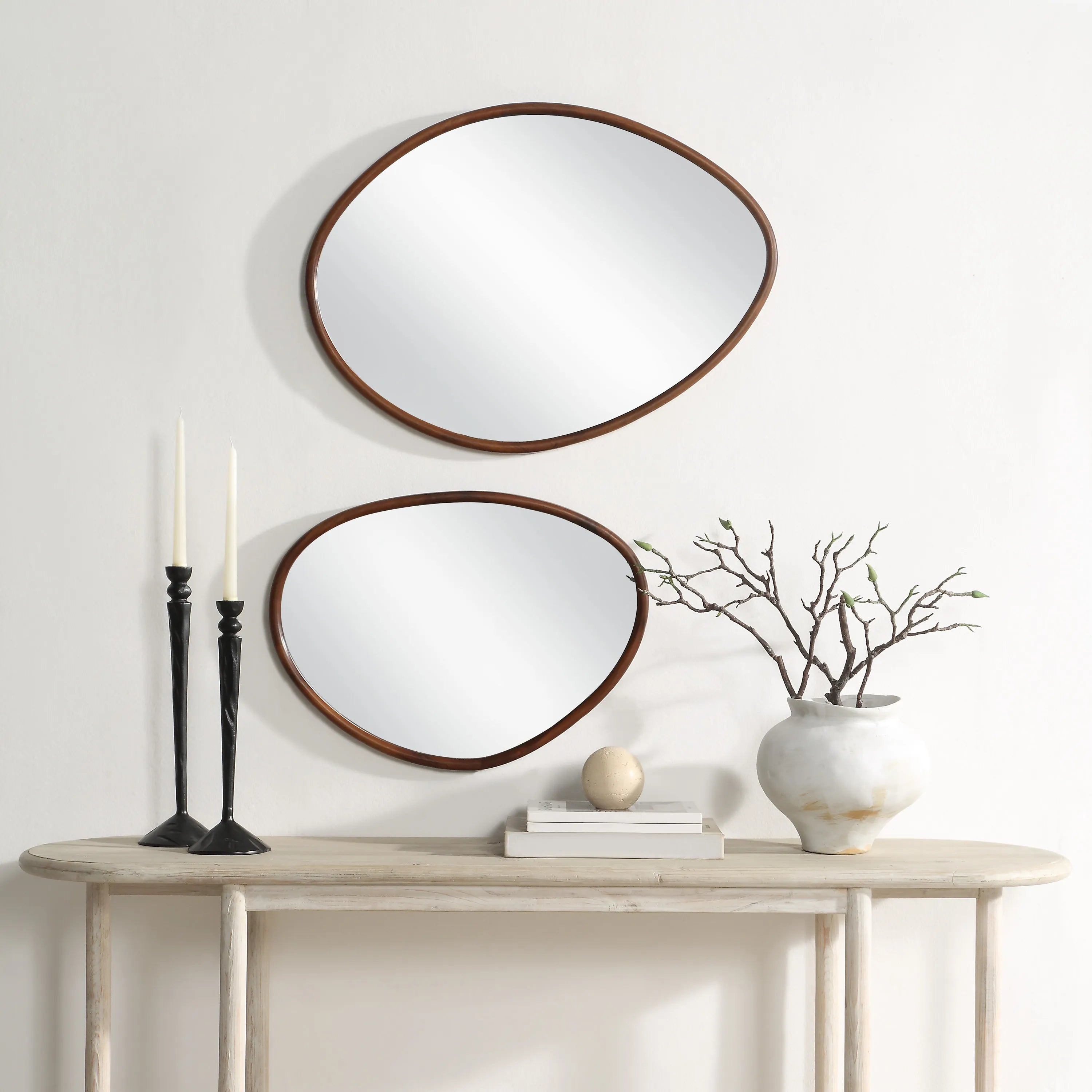 Solstice Wall Mirror Set displayed above a console table with decor accents