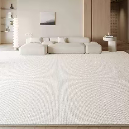 Sophia Rug in a soft cream tone styled in a modern living room with a beige sofa, wood accents, and neutral decor