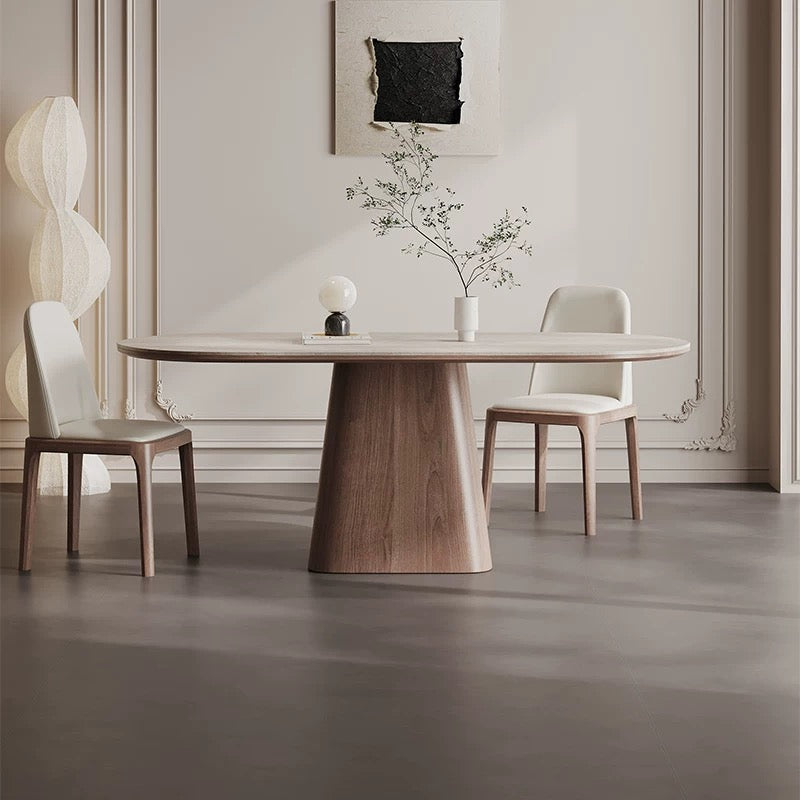 Front view of Sorella pedestal dining table with sintered stone top and solid wood base in elegant neutral dining room