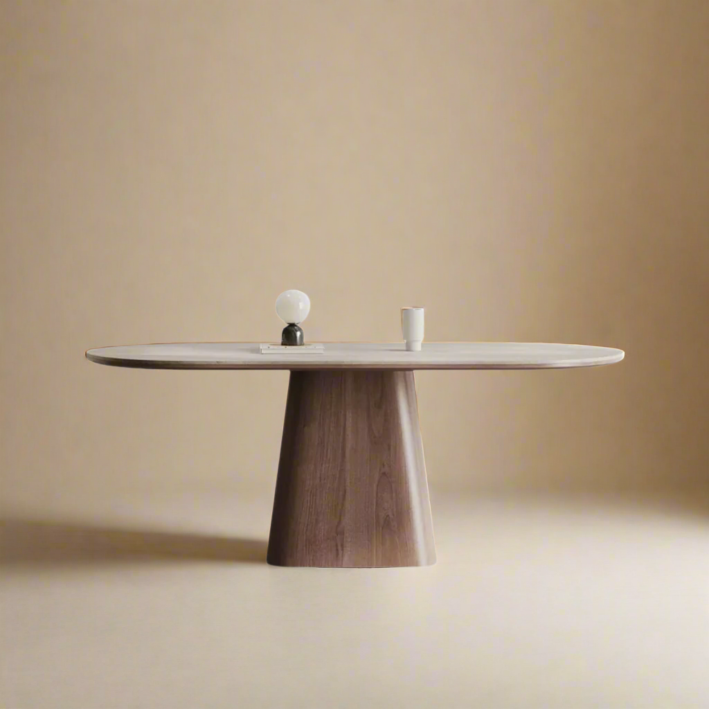 Sorella pedestal dining table with sintered stone top and solid wood base on beige studio background