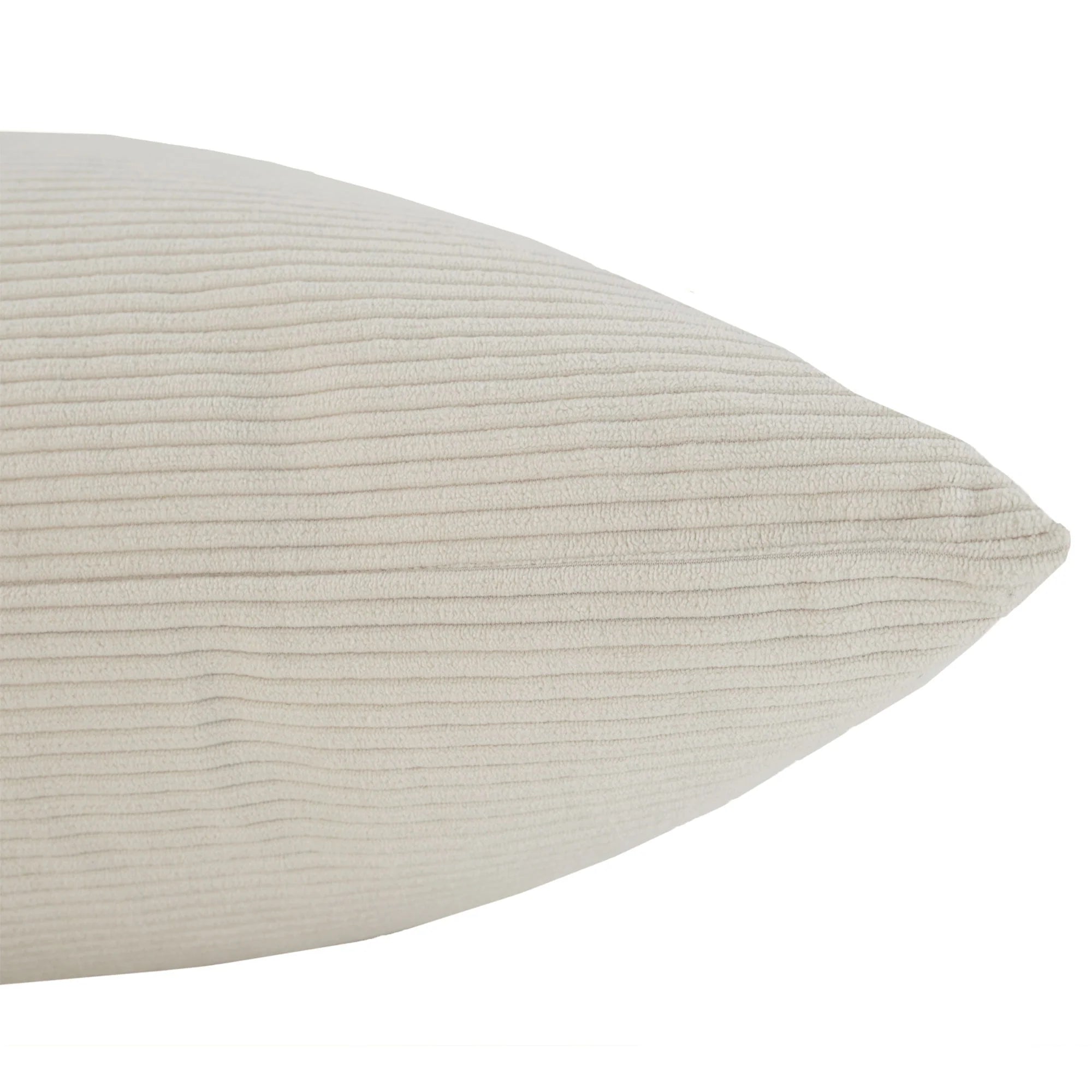 Side profile view of the plush Sutton throw pillow highlighting its thickness and fine cream ribbed corduroy texture.