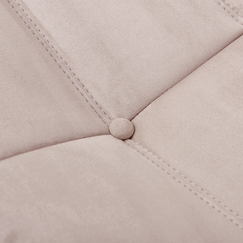 Macro detail shot of the button tufting and soft fabric texture on the TOGO Lounger.