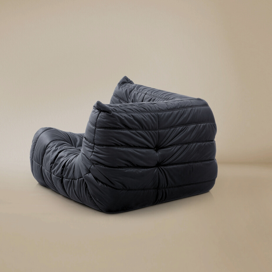 Back view of the TOGO corner unit showing the fully upholstered finish for open floor plan placement.